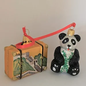 Impuls Pandabär mit Reisekoffer China