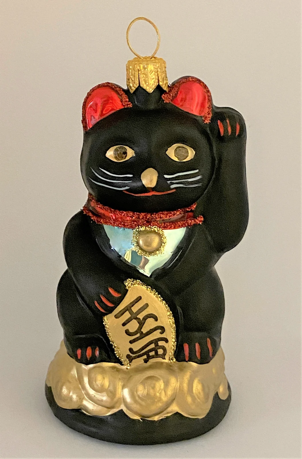 Impuls Kleine schwarze Maneki-Neko , asiatische Glückskatze