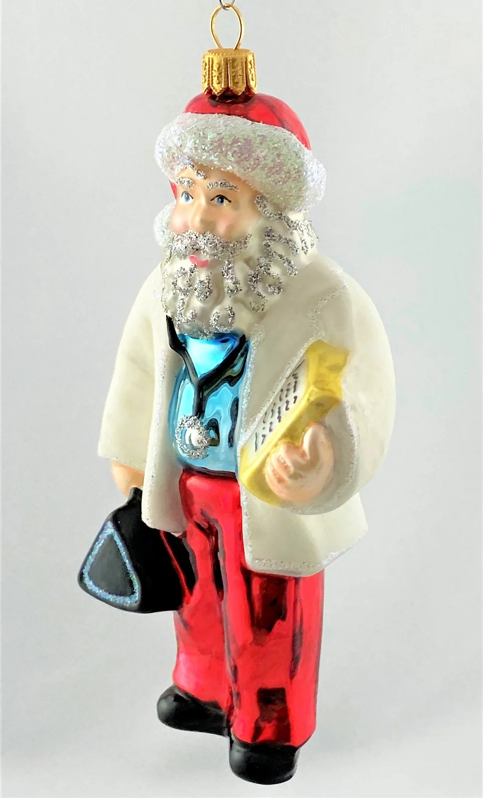 Sonstige Santa Claus mit schwarzem Arztkoffer und Stethoskop