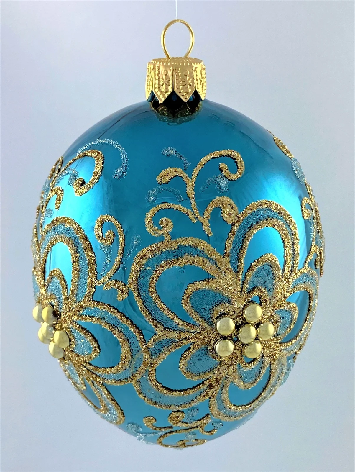 Dagmara Ei-Form petrol mit Gold-Blumen-Dekor