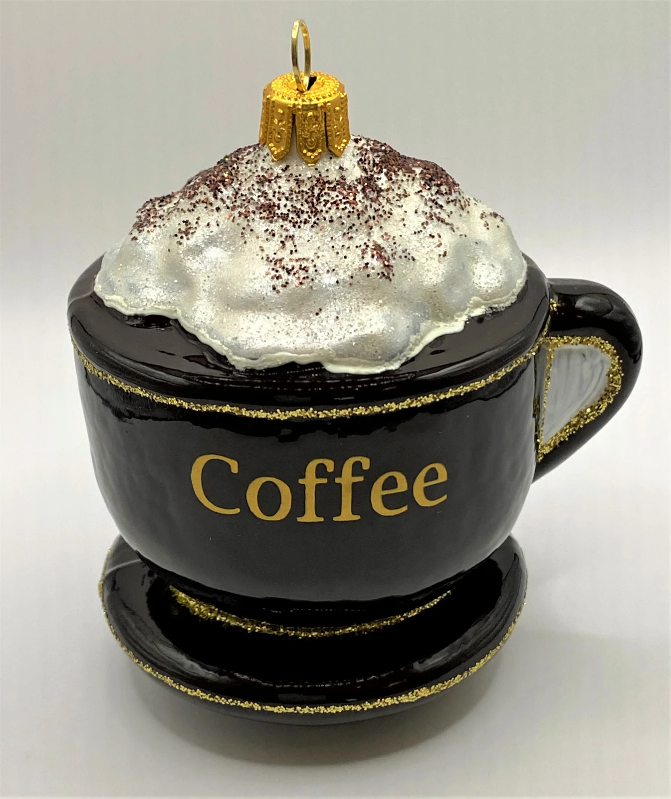 Impuls Kaffee mit Schlagsahn in brauner Tasse