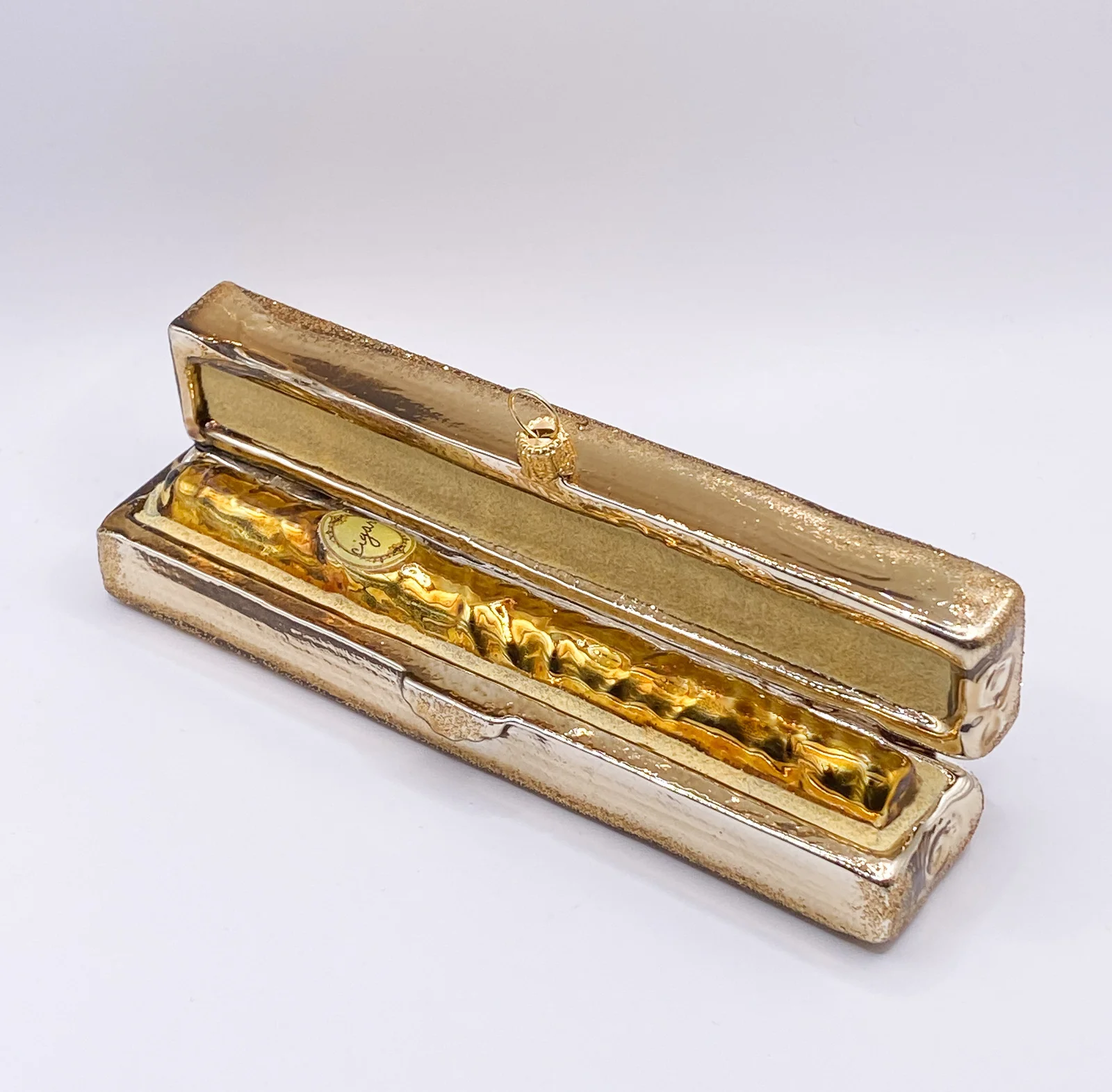 GMC Goldenes Zigarren-Etui mit goldener Zigarre