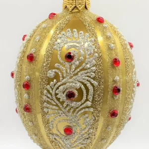 Dagmara Ei-Form gold mit weissem Dekor und roten Schmucksteinen