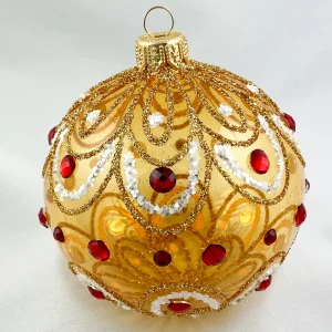 Dagmara Kugel gold transparent stilisiertem Blätterdekor und roten Steinen