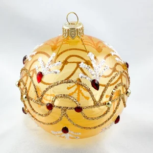 Dagmara Kugel gold transparent mit Wellenmotiv und roten Steinen