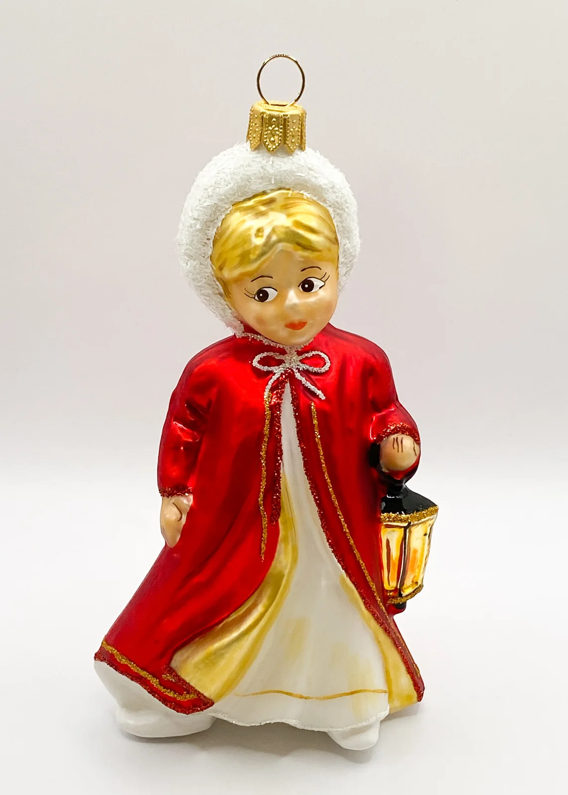Hanco Das Christkind im roten Cape leuchtet mit der Laterne