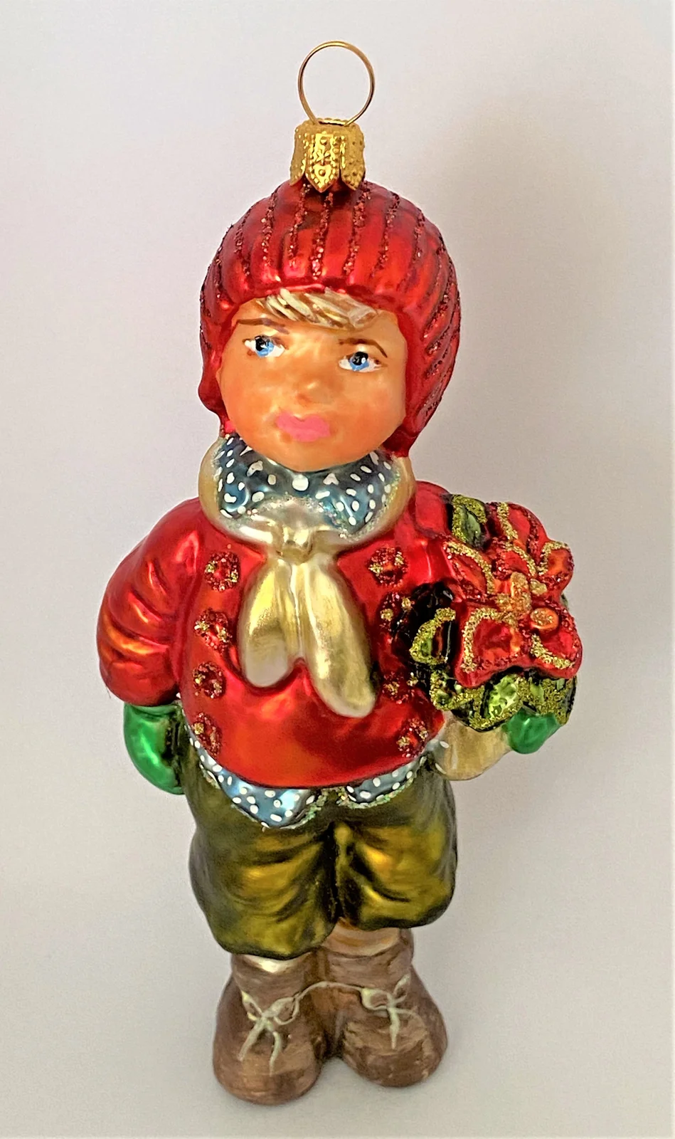 Komozja Junge mit roter Mütze und Weihnachtsstern unter dem Arm, KOMOZJA MOSTOWSKI