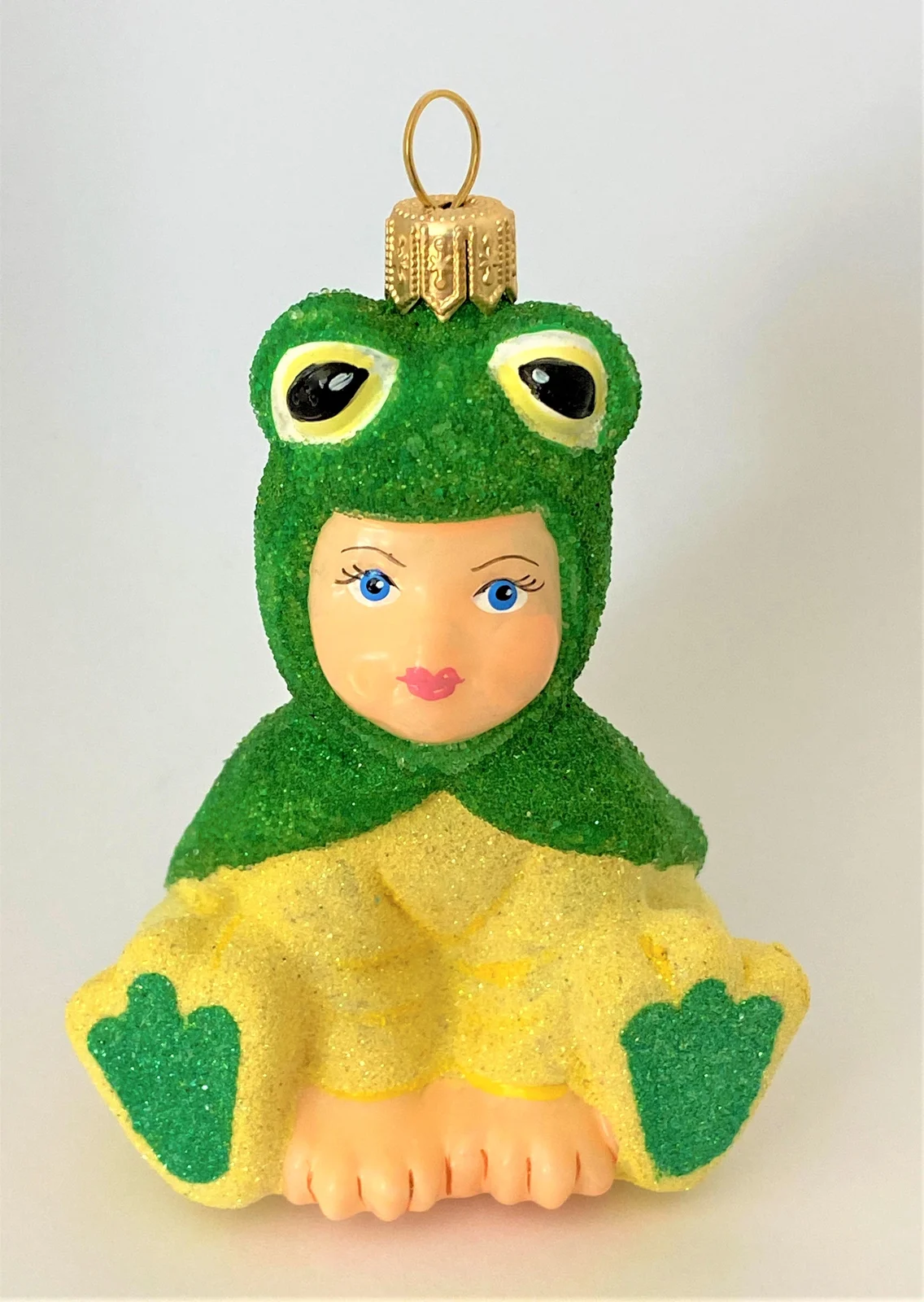 Komozja Kind im Froschkostüm, KOMOZJA MOSTOWSKI