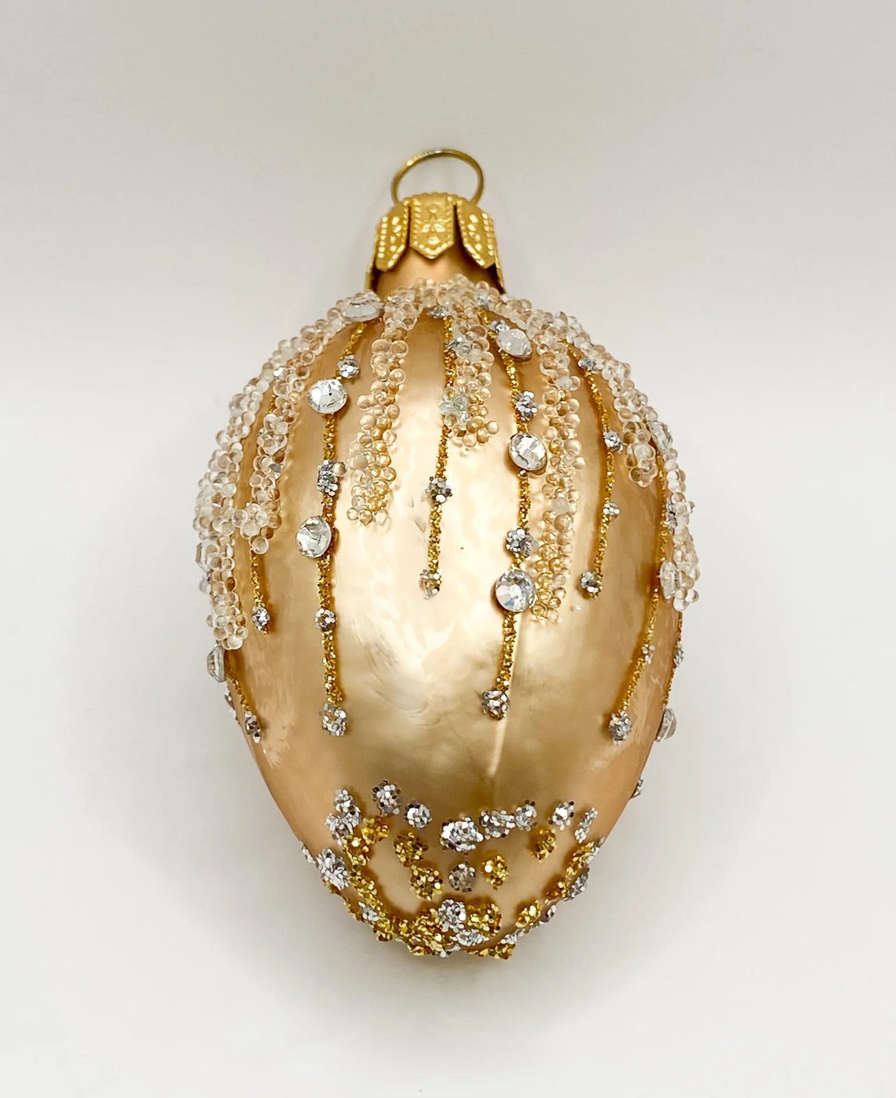 Szklo Kleines goldenes Ei mit Schmucksteinen