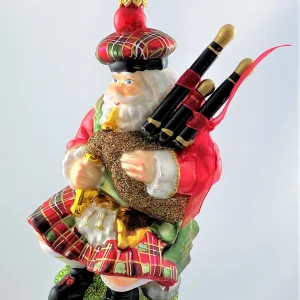 Glassware Weihnachtsmann im Schotten-Rock spielt den Dudelsack