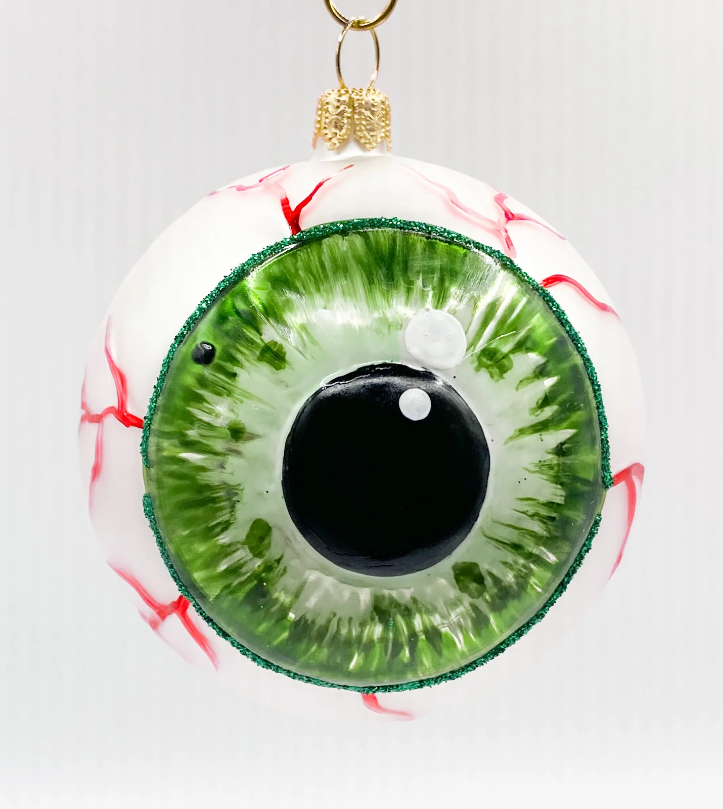 Wiktoria Anatomisches Auge mit grüner Iris und runder Pupille