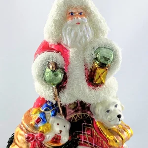 Glassware Santa ist mit dem Hund im Schneegestöber unterwegs