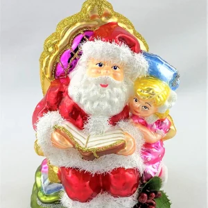 Glassware Weihnachtsmann liest dem Mädchen eine Weihnachtsgeschichte vor