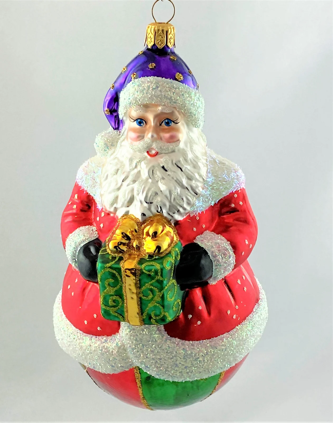 Hanco Weihnachtsmann auf rot-grün gestreifter Kugel