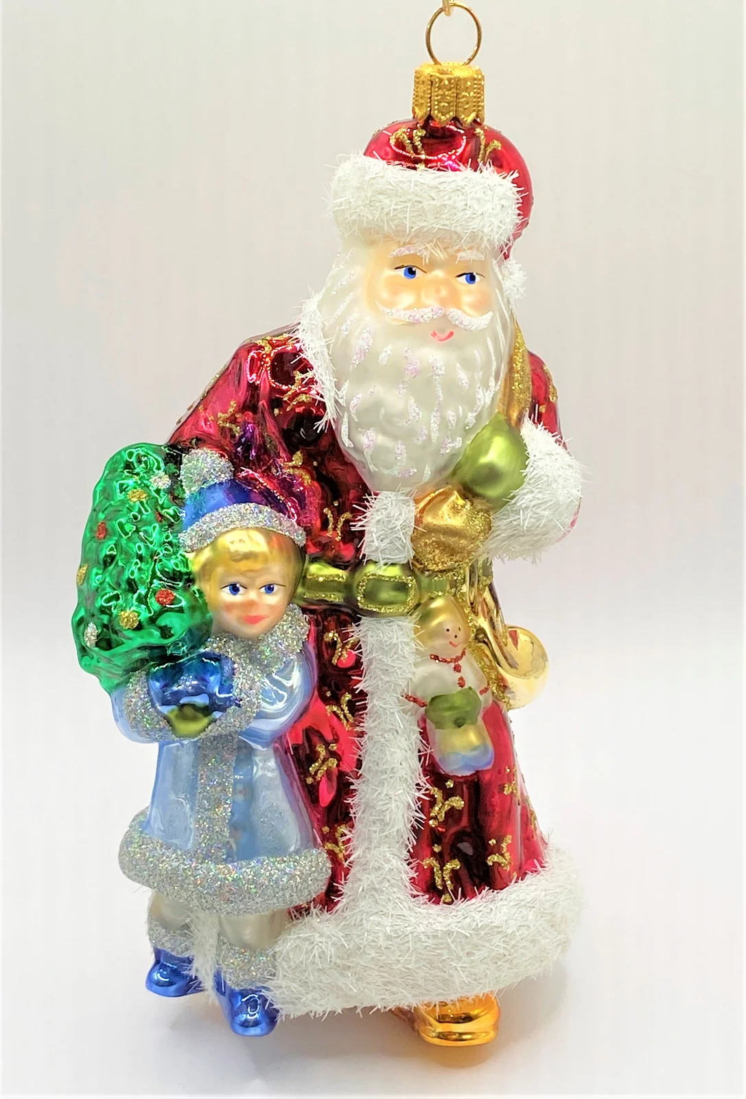 Glassware Weihnachtsmann mit Kind im hellblauen Mantel