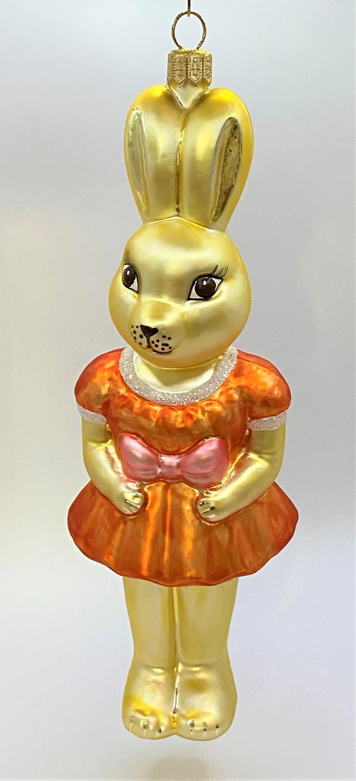 Sonstige Osterhasen-Mädchen in orangem Kleidchen