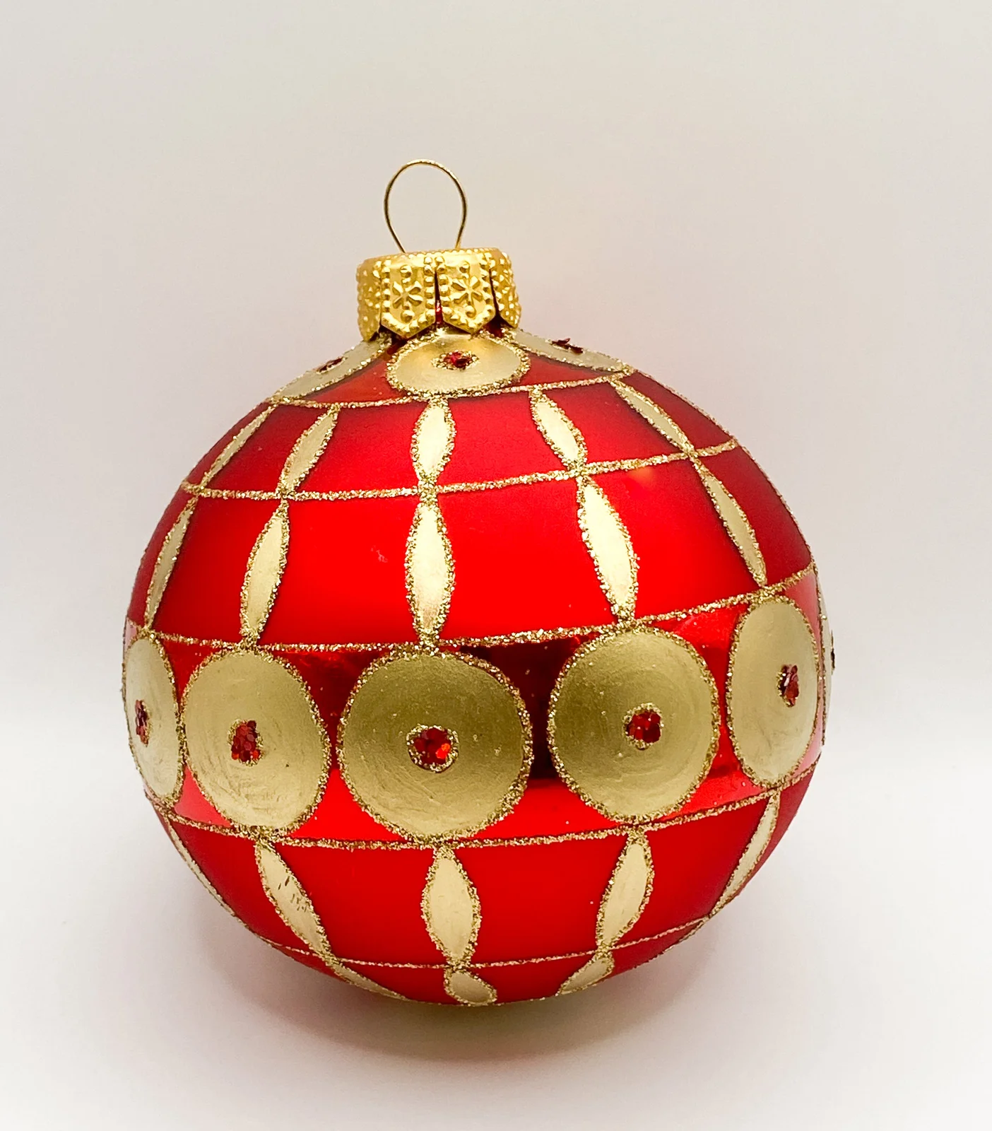 GMC Rote Kugel mit goldenem Art-Deco Muster