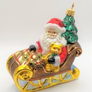 Hanco Weihnachtsmann bringt den Christbaum mit dem Schlitten, karierte Decke