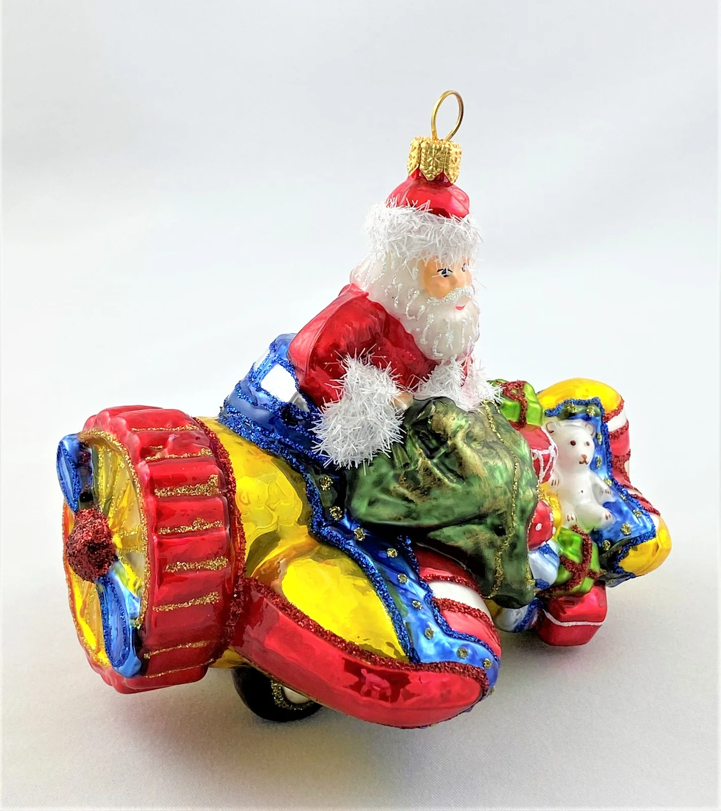 Glassware Weihnachtsmann bringt die Geschenke mit dem Propellerflugzeug