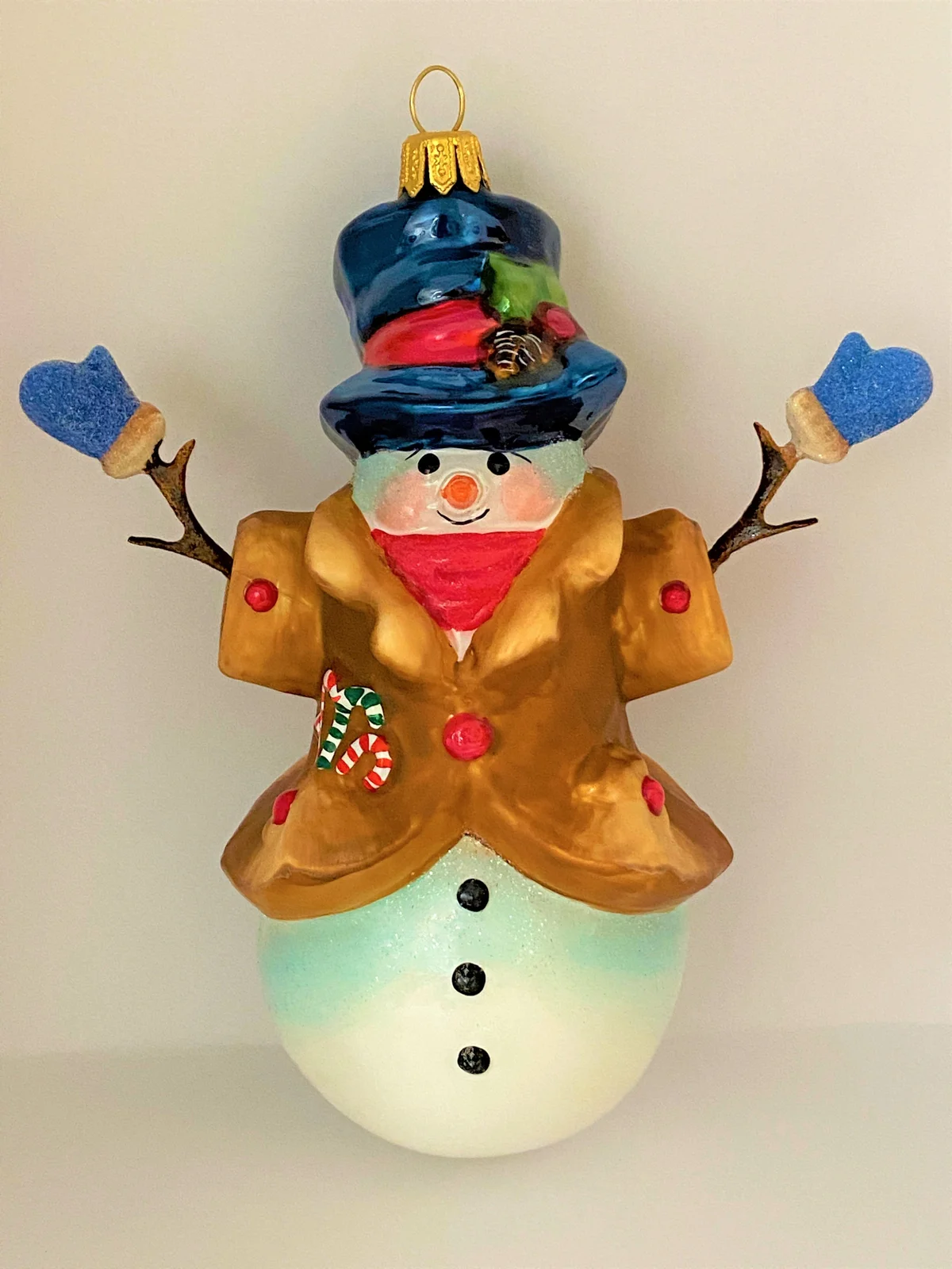 Komozja Schneemann mit blauen Handschuhen, KOMOZJA MOSTOWSKI