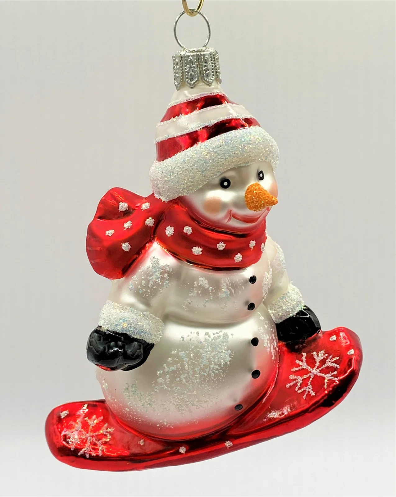 Hanco Schneemann auf Snowboard