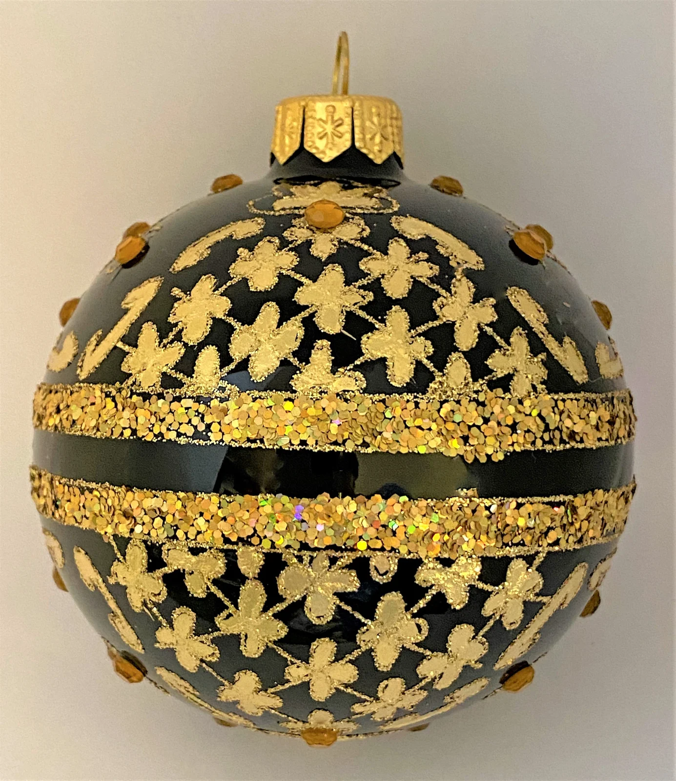 GMC Kugel schwarz mit Golddekor mit Schmucksteinen
