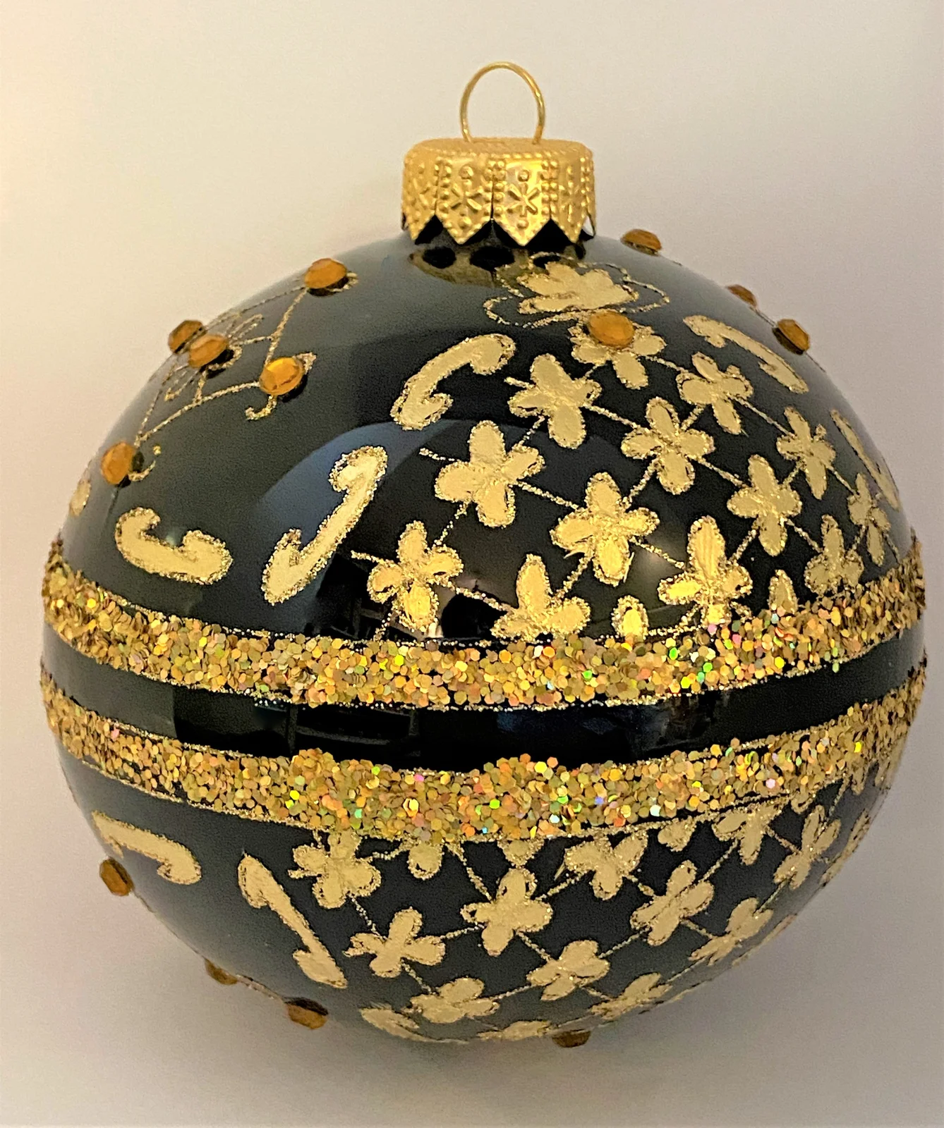 GMC Kugel schwarz mit Golddekor mit Schmucksteinen