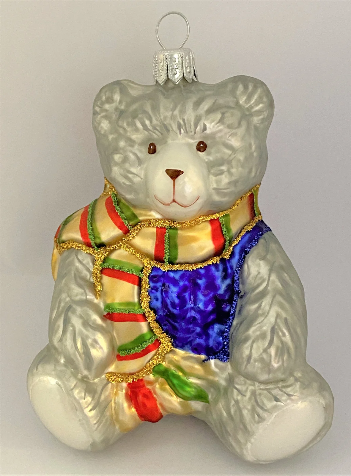 Christborn grauer Teddybär im blauen Wollpullover