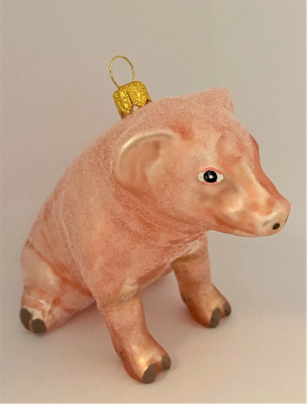 GMC Sitzendes Schweinchen