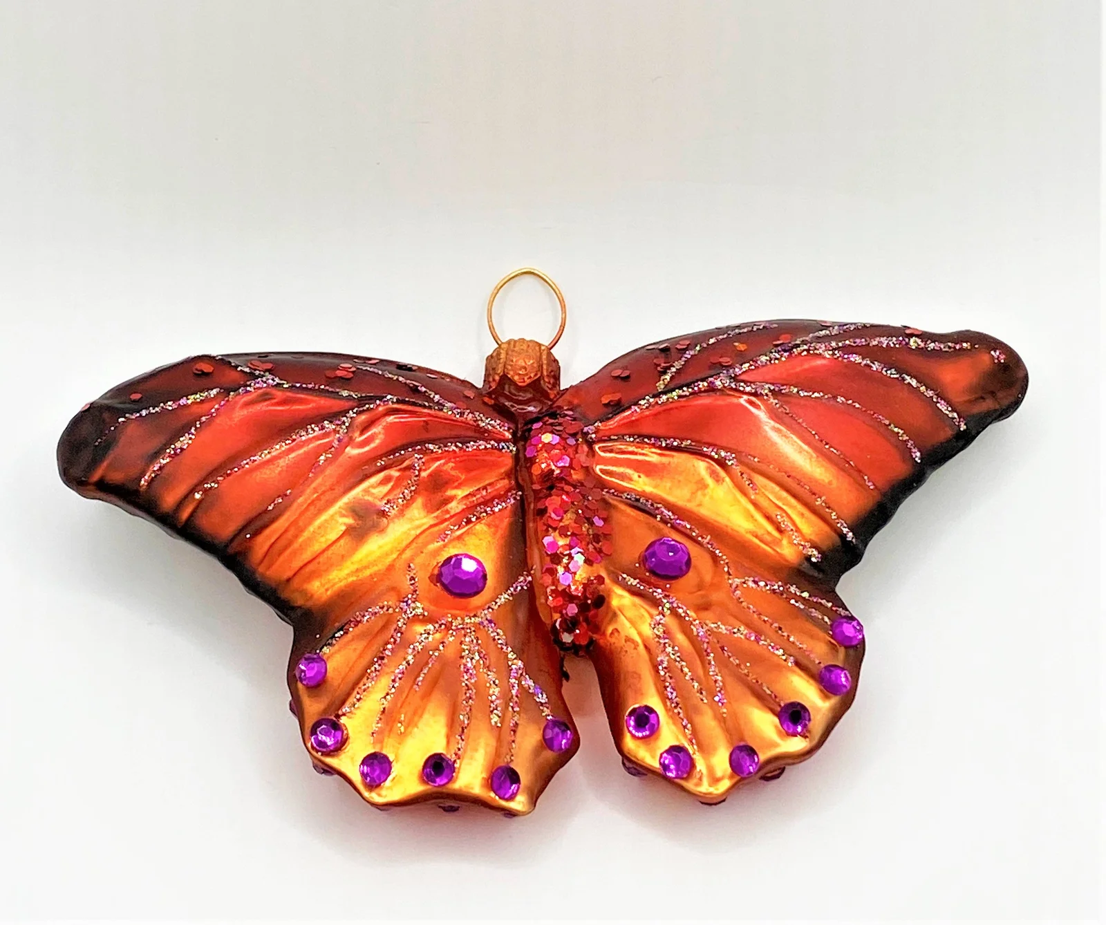 GMC Rostroter Schmetterling mit violetten Schmucksteinen