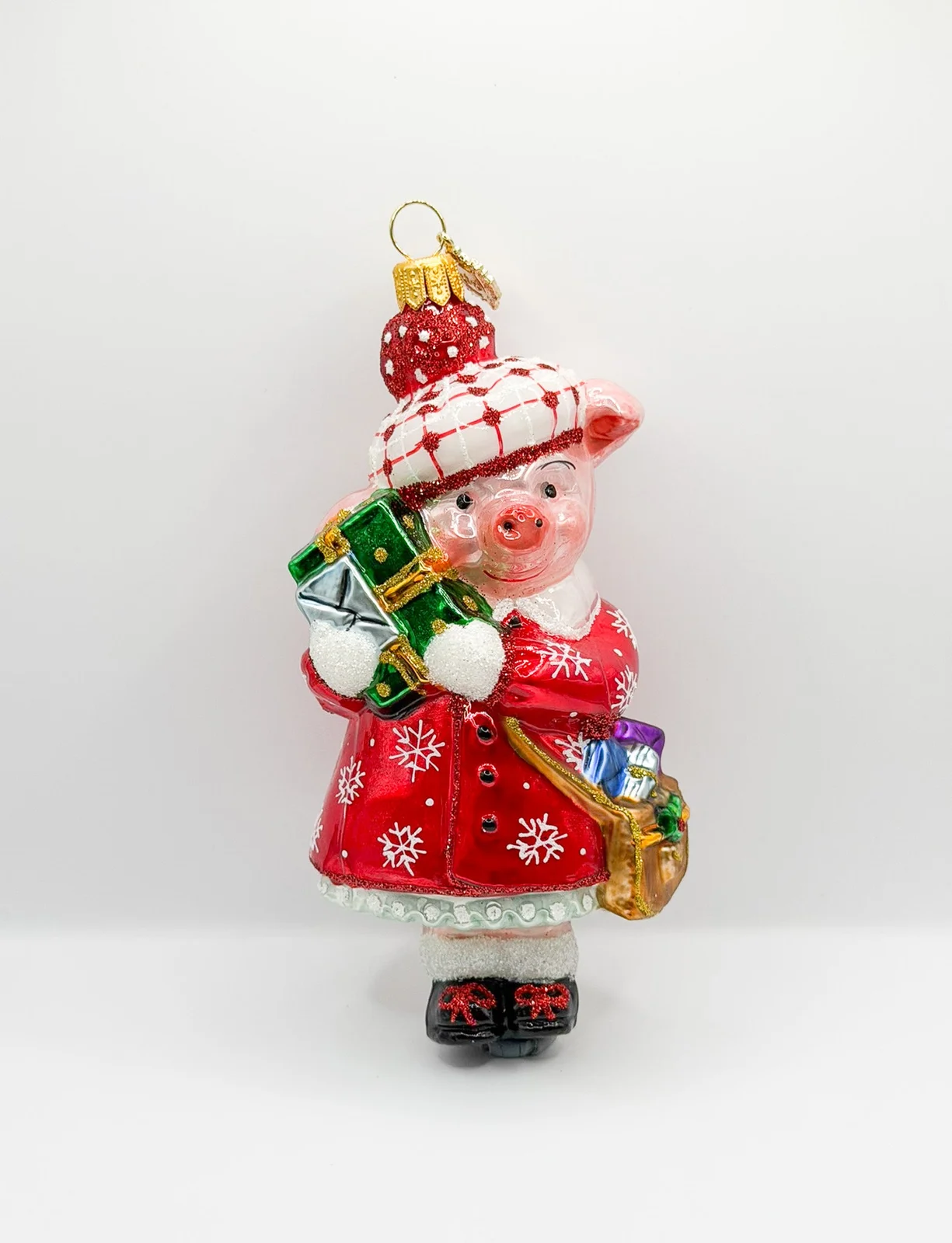 Glassware Schweinchen im Winterkleid bei den Weihnachts-Einkäufen
