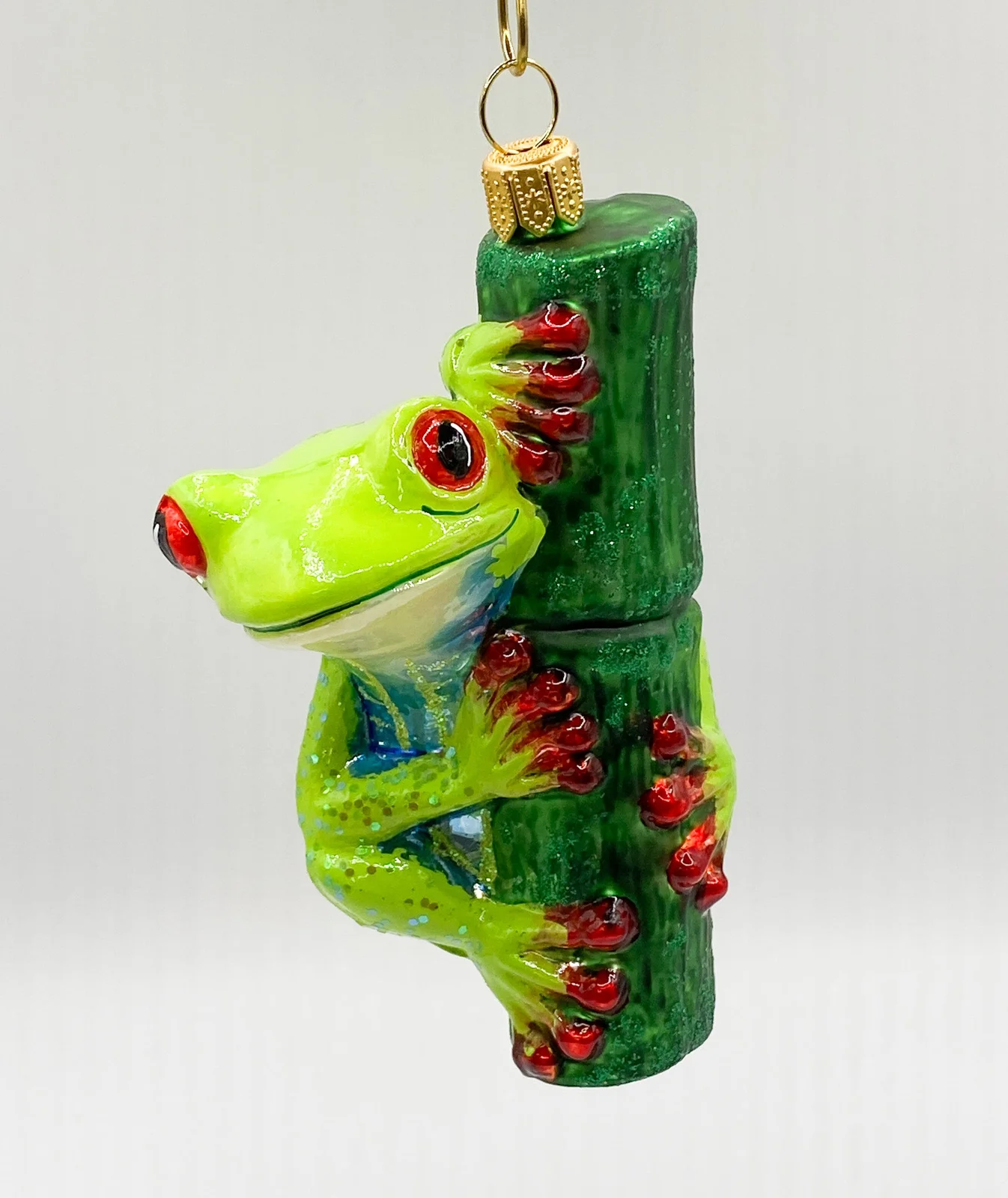 Impuls Lustiger Frosch am Grashalm