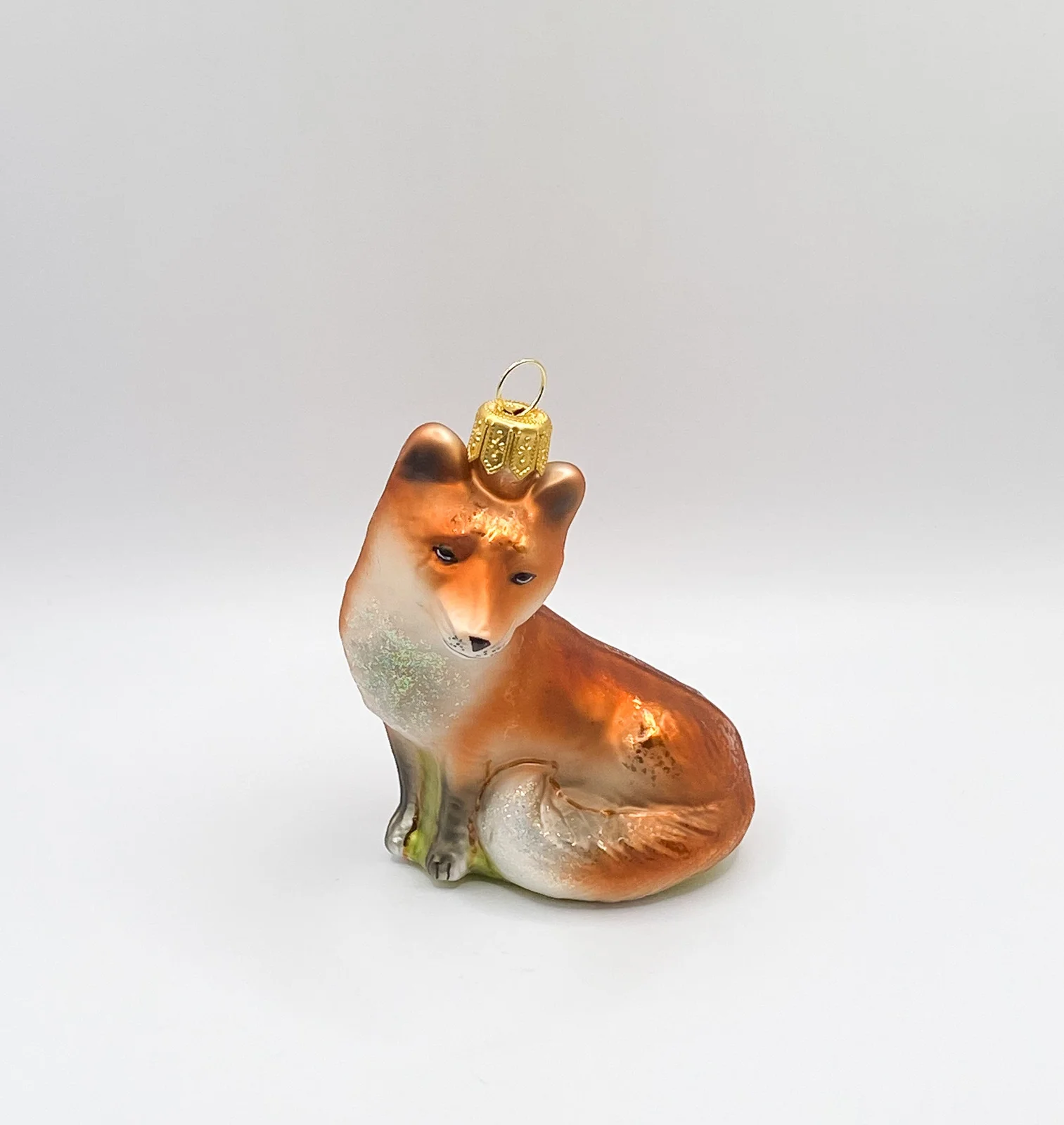Hanco Sitzender verschmitzter Fuchs