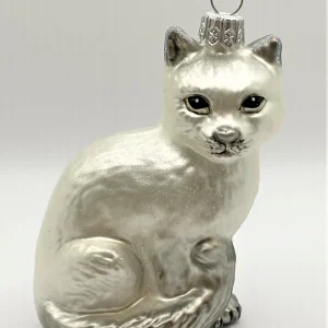 Glaspol Sitzende weisse Katze mit grauem Schwanz