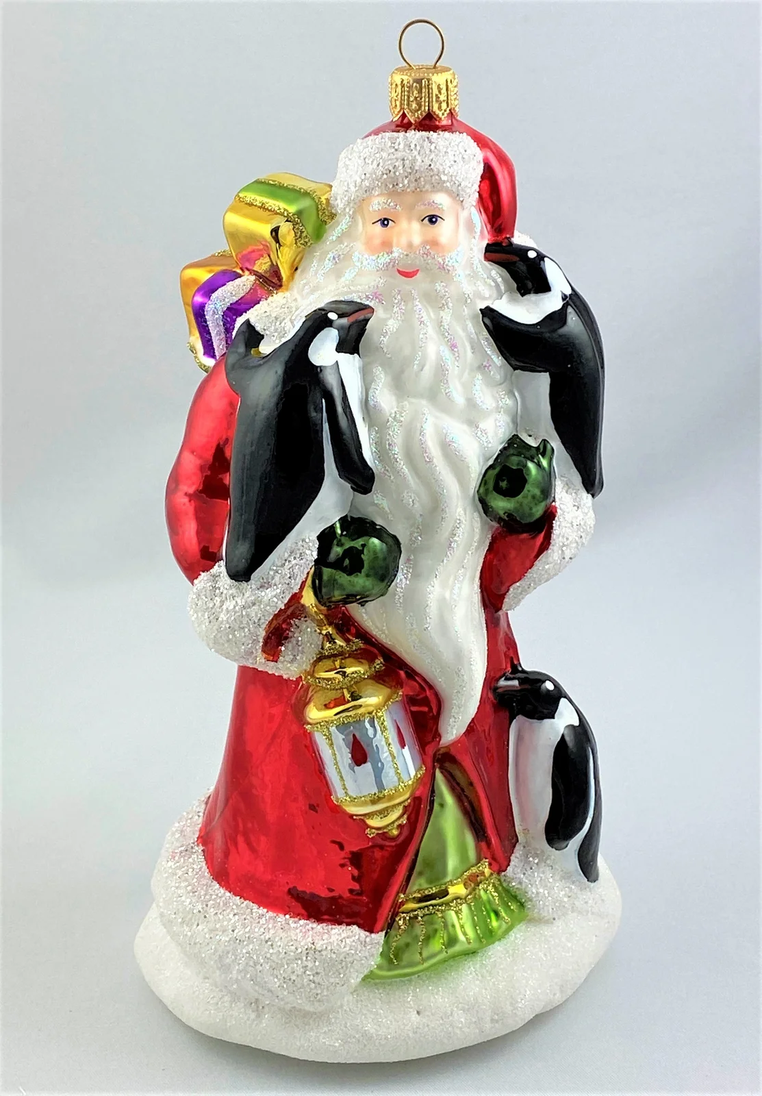 Glassware Weihnachtsmann bringt den Pinguinen die Weihnachtsgeschenke