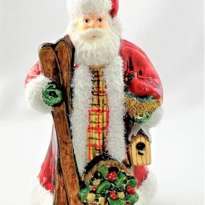 Glassware Santa bringt den Kardinal mit den Skiern in den Wald