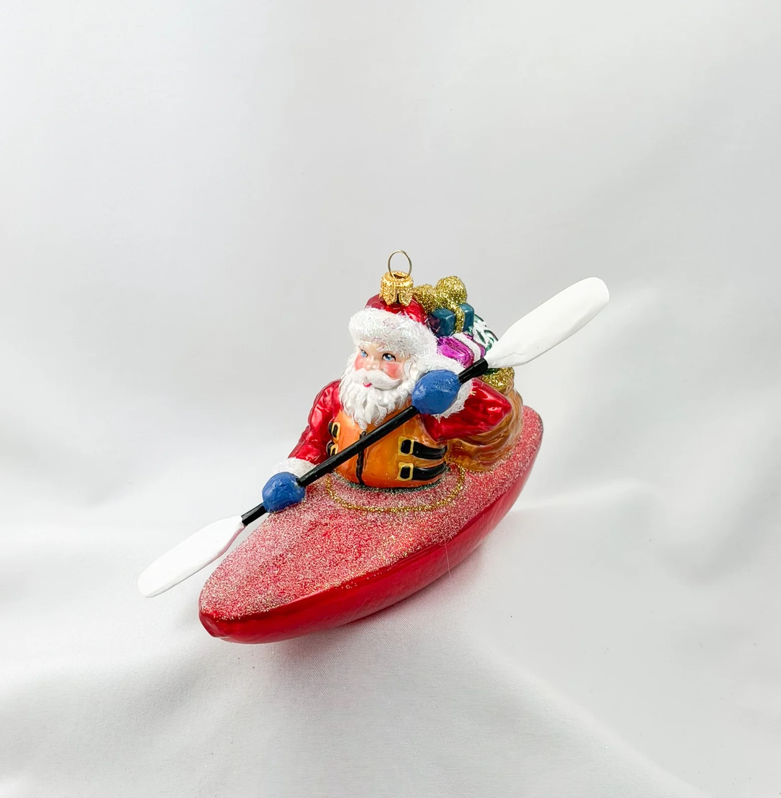 Impuls Santa Claus bringt die Geschenke mit dem Kajak