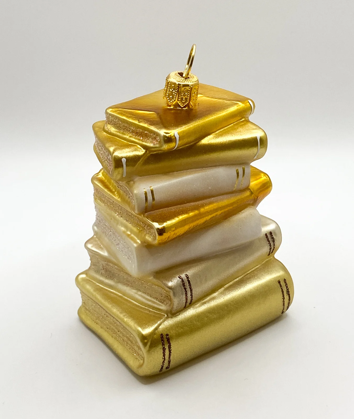 GMC Goldener Bücherstapel