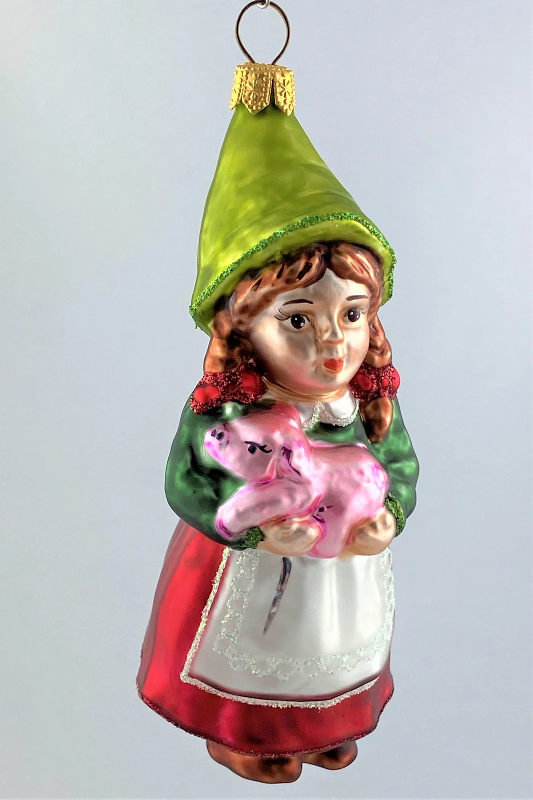 Hanco Zwergenmädchen mit rosa Schweinchen auf dem Arm
